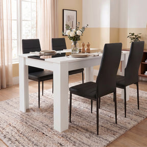 [4 Seater | Black] White & Black Gloss 4-6 Seater Dining Table with four black faux-leather chairs and a white rose centrepiece