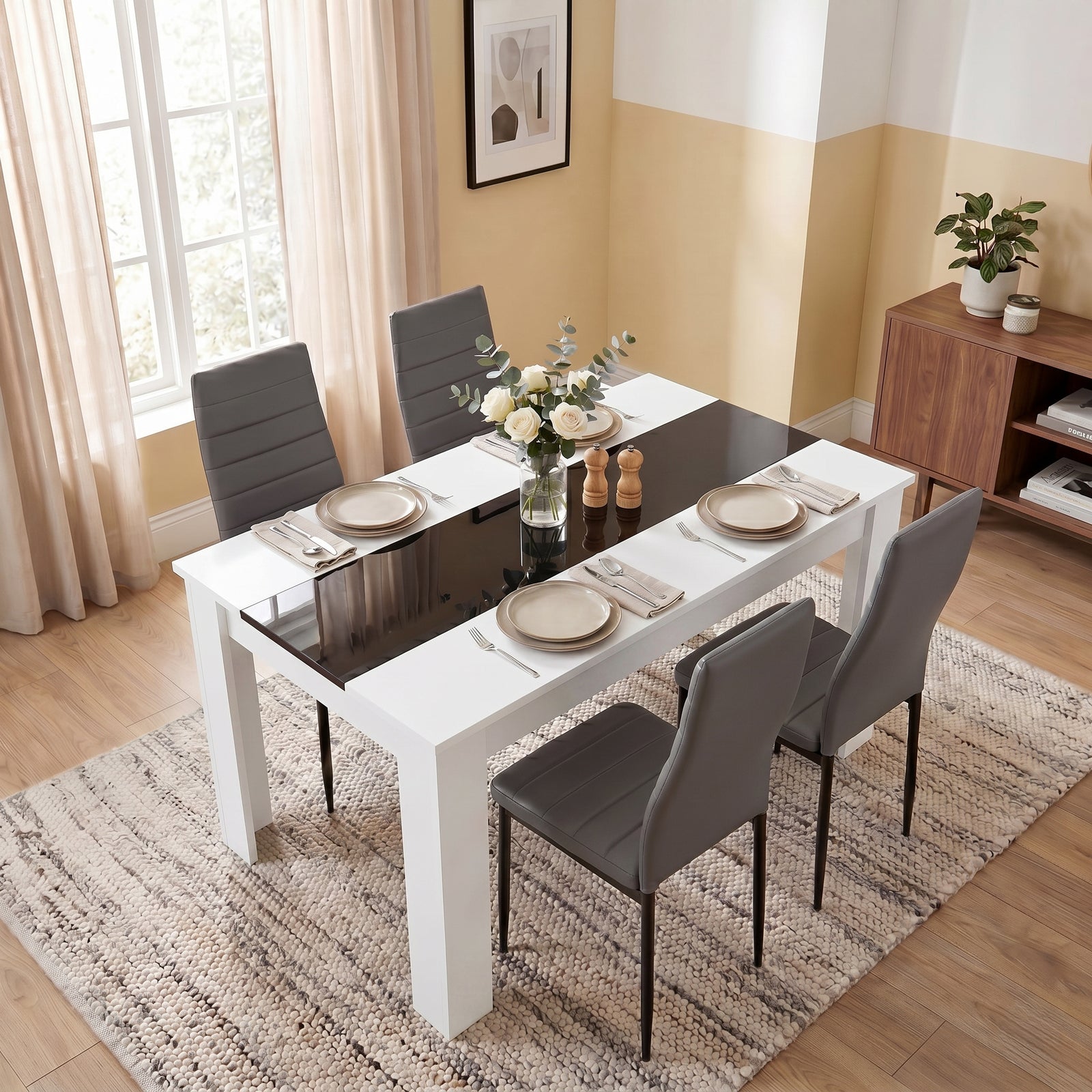 [4 Seater | Grey] White & Black Gloss 4-6 Seater Dining Table viewed from above with four grey faux-leather chairs and neutral place settings on a woven rug