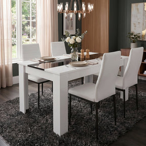 [4 Seater | White] White & Black Gloss 4-6 Seater Dining Table with four white faux-leather chairs and a rose centrepiece on a dark shag rug beneath 