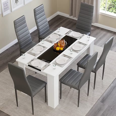 aerial view of dining table sets for 6 showing gloss white and black striped table paired with grey chairs