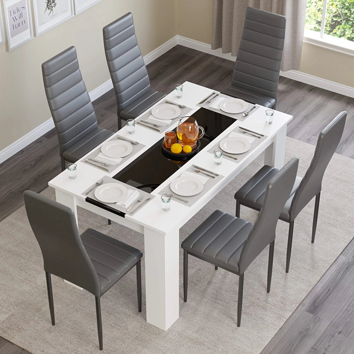 [6 Seater | Grey] angled top-down view of six grey PU chairs around the white gloss dining set with plates and fruit