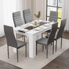 minimalist dining tables and 6 chairs set featuring white gloss table with black strip and grey chairs