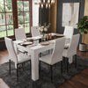 [6 Seater | White] White & Black Gloss 4-6 Seater Dining Table styled with six white faux-leather chairs, placed on a dark shag rug in a contemporary dining room