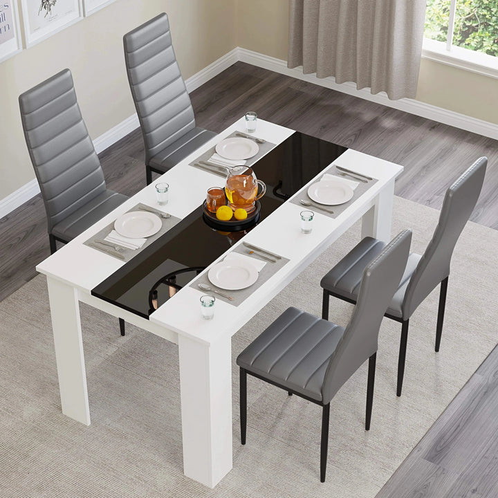[4 Seater | Grey] overhead-angle scene: four grey chairs around the 112cm table with central black inlay and fruit