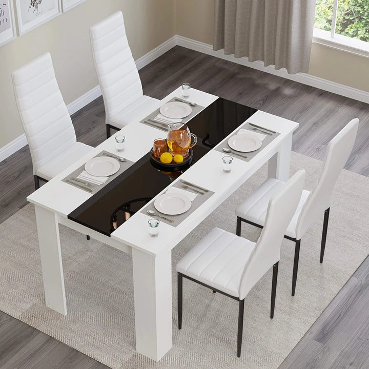 [4 Seater | White] angled top-down view of four white PU chairs around the 4 seater white gloss dining set with plates