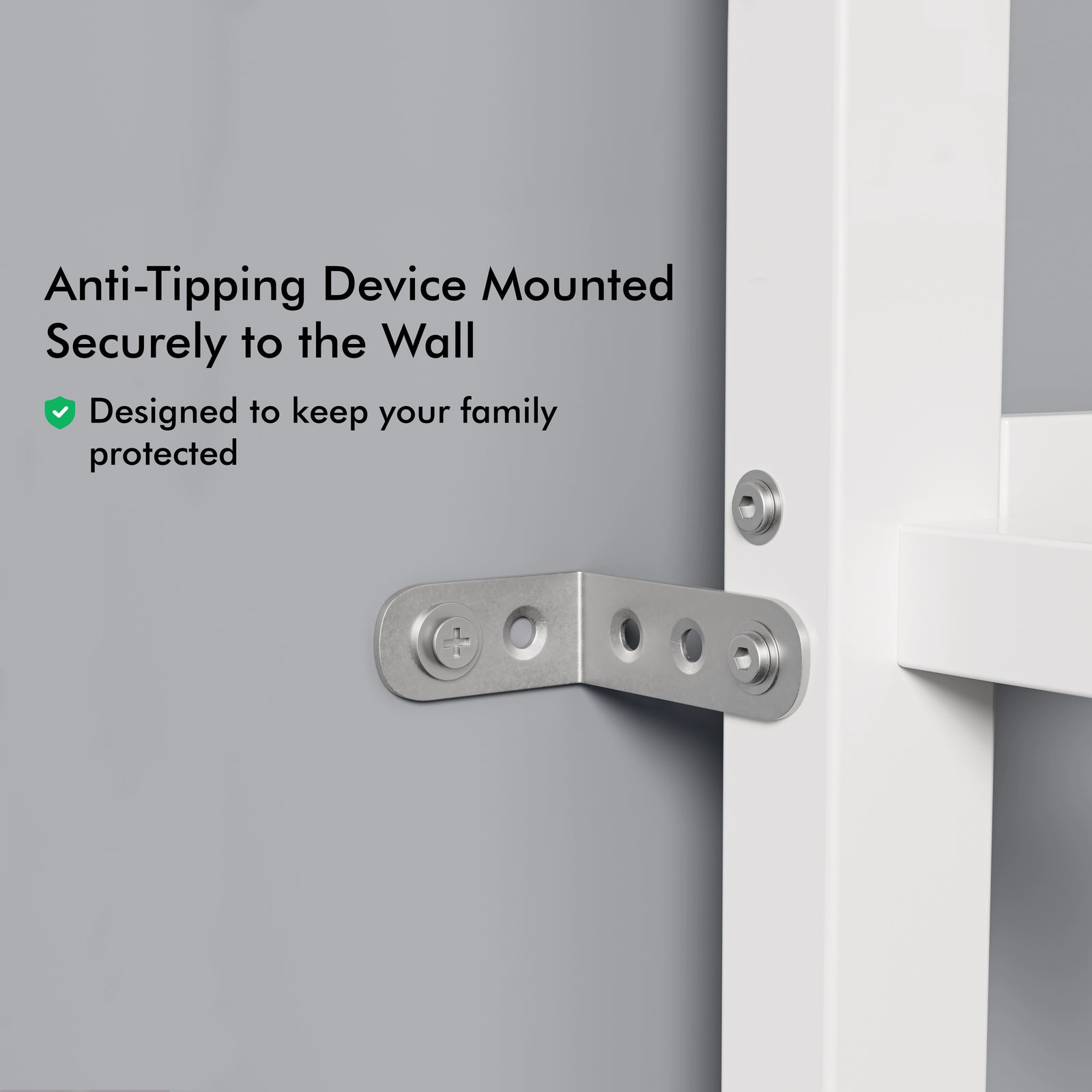 [white + pine] close-up of metal anti-tipping bracket securing white bunk bed frame to wall