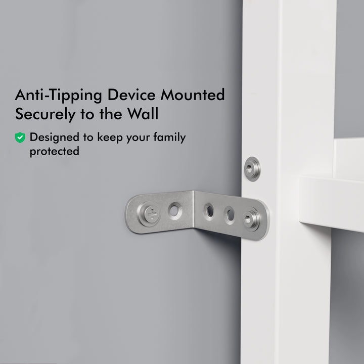 [white + pine] close-up of metal anti-tipping bracket securing white bunk bed frame to wall
