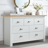 White chest of drawers with oak top, featuring multiple storage compartments and silver handles.