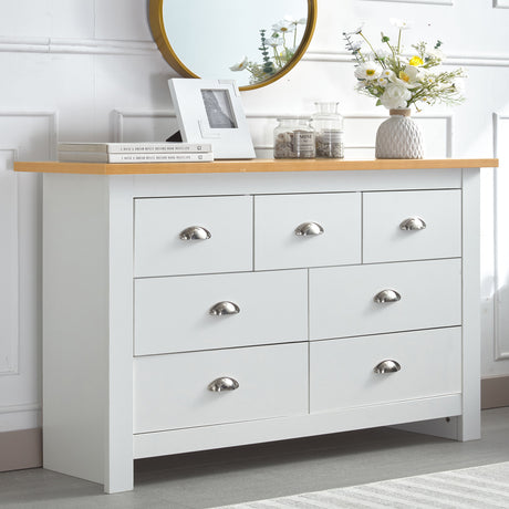 White chest of drawers with oak top in the UK, perfect for flowers or decorative items.