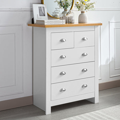 White chest of drawers with five drawers, chrome handles, and a wooden top.