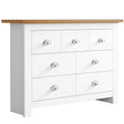 White chest of drawers with oak top and handles, blending modern design with practical storage.