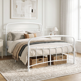 [White | Double] White metal bed frame with curved rails and white bedding, shown at a 3/4 Angle in bright bedroom.