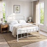 [White | Double] White metal bed frame with white bedding, wood side tables and a woven rug in a bright bedroom.