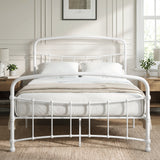 [White | Double] Front view of a white metal bed frame with curved rails and white bedding in a bright bedroom.
