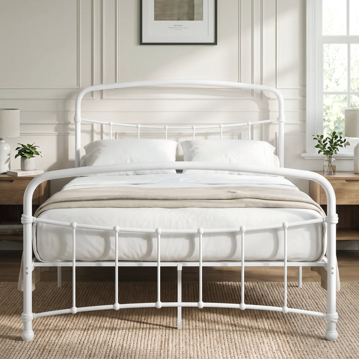 [White | Double] Front view of a white metal bed frame with curved rails and white bedding in a bright bedroom.