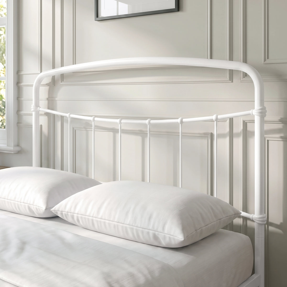[White | Double] Close-up of the white curved headboard with vertical bars, white pillows and cream bedding.