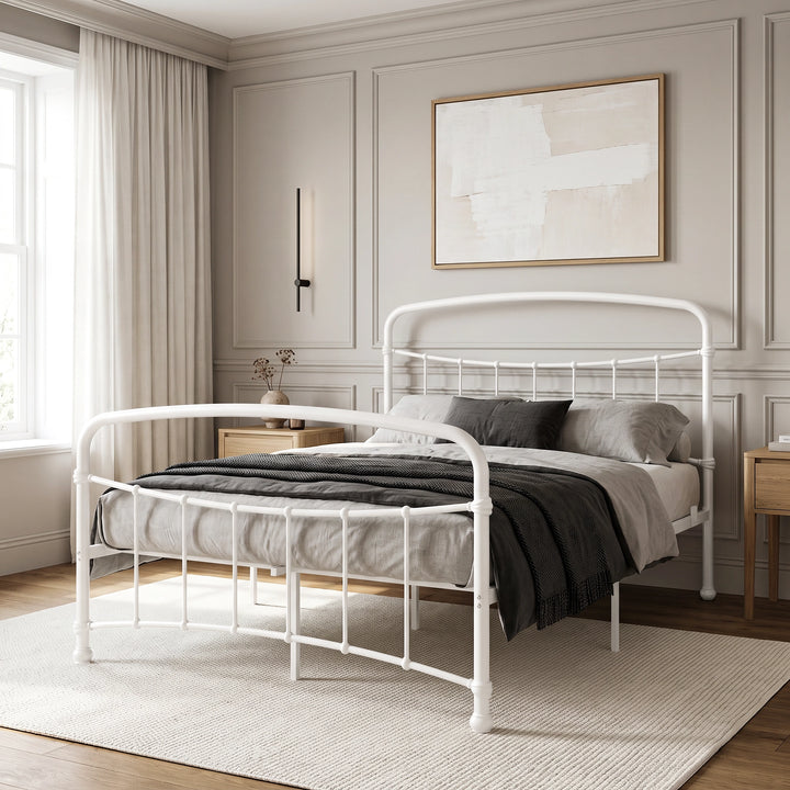 [White | Double] White metal bed frame with white bedding, wood side tables and a woven rug in a bright bedroom.