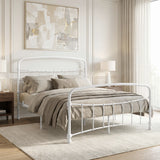[White | King] White metal bed frame with taupe bedding, shown at a 3/4 Angle in a bright bedroom with a rug.