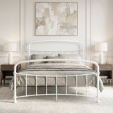 [White | King] Front view of a white metal bed frame with curved rails and taupe bedding in a bright bedroom.