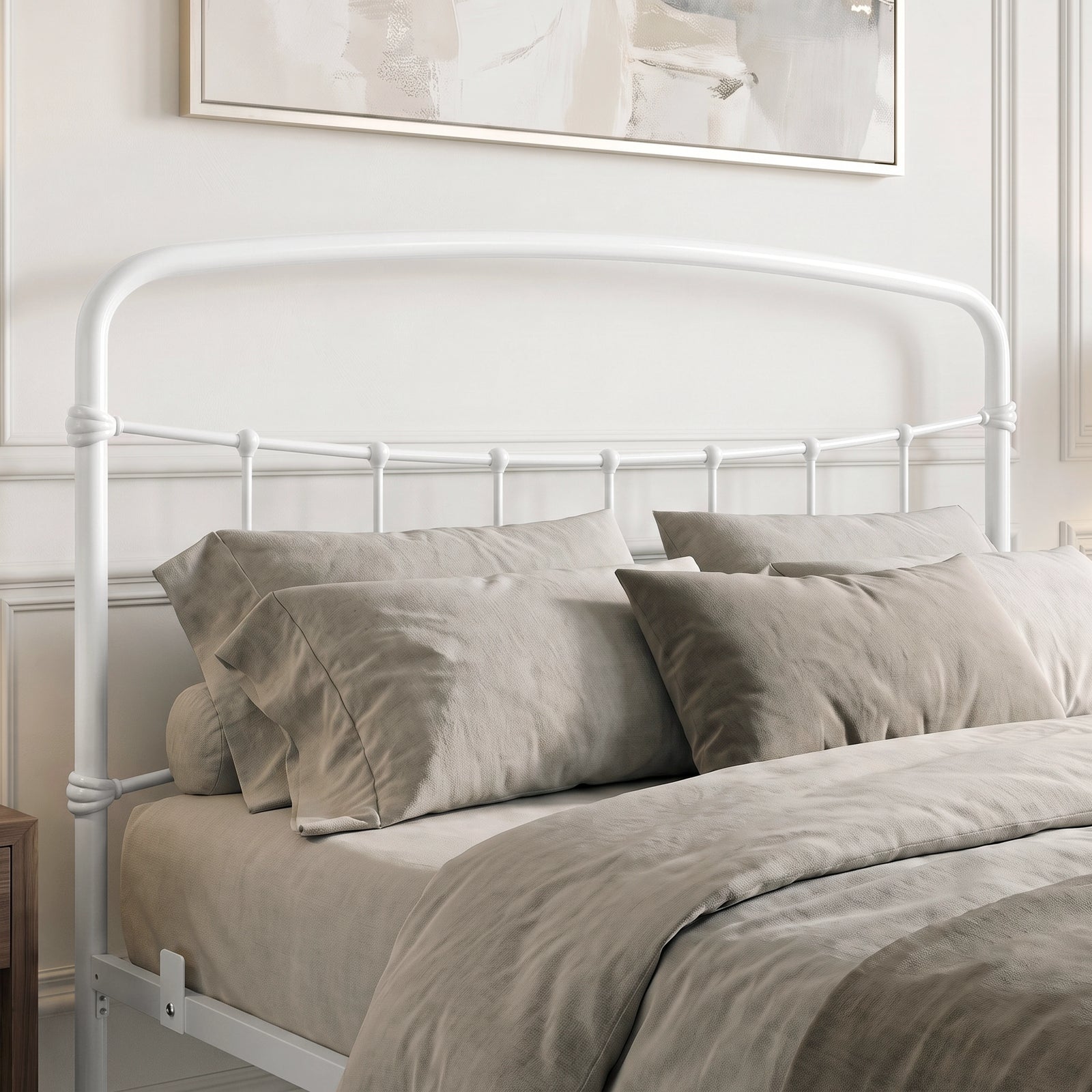 [White | King] Close-up of the white curved headboard with vertical bars, taupe pillows and layered bedding.