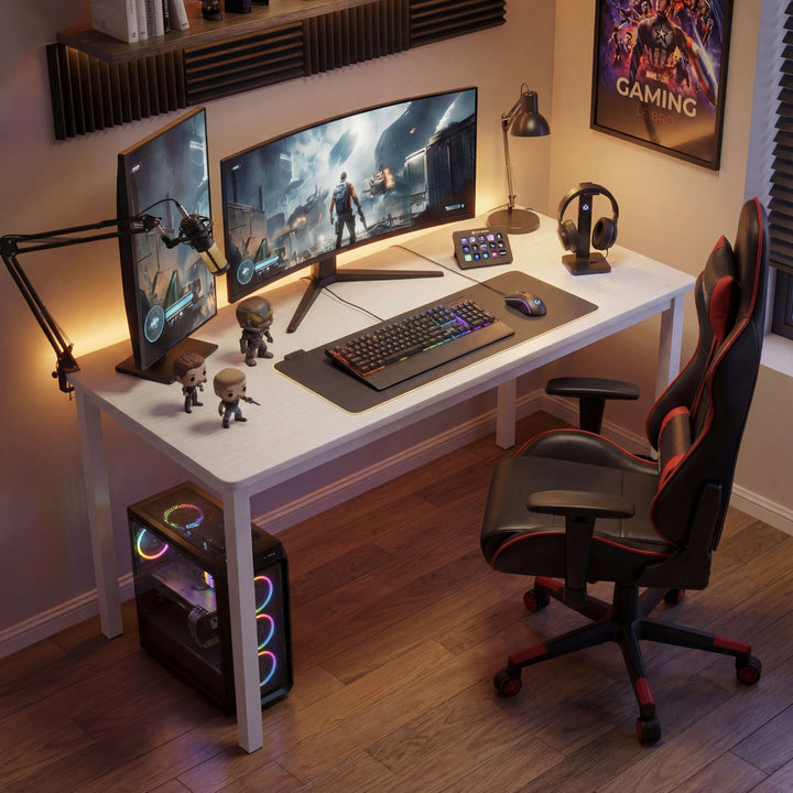 [100 x 50 cm] Home Office Desk 100cm angled gaming room setup with dual curved monitors, microphone arm, RGB keyboard, collectible figures, and red gaming chair in warm amber lighting