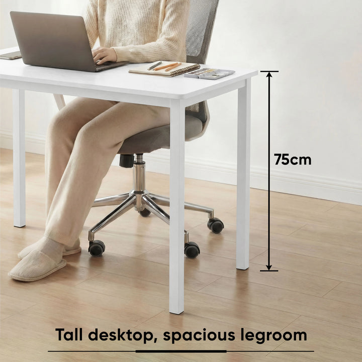 [100 x 50 cm] Home Office Desk 100cm height detail showing person seated at 75cm desk in slippers with laptop and legroom clearance annotated