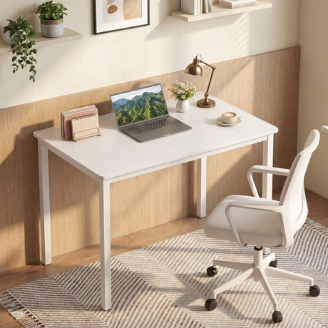 [80 x 50 cm] Home Office Desk angled in warm home office corner with wood-panelled wall, laptop, brass lamp, daisy posy, coffee cup, and white office chair on patterned rug
