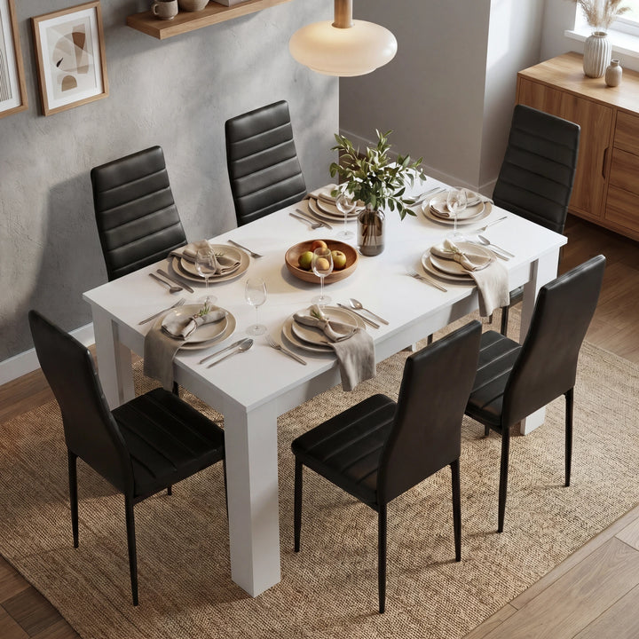 [6 Seater | Black] Dining Table and Chairs Set seen from directly above with six place settings, linen napkins, glassware, fruit bowl, and a plant centrepiece