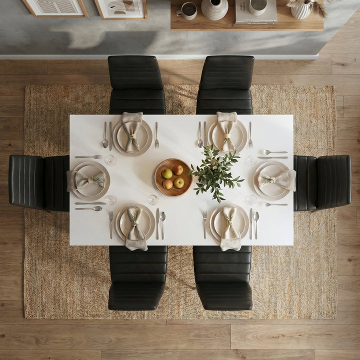 [6 Seater | Black] Dining Table and Chairs Set with six dark faux leather chairs around a white table in a bright open-plan dining room with garden view