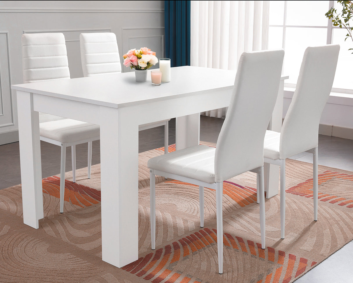 White dining table with matching chairs, perfect for elegant and modern dining.