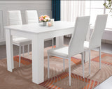 White dining table with matching chairs, perfect for elegant and modern dining.