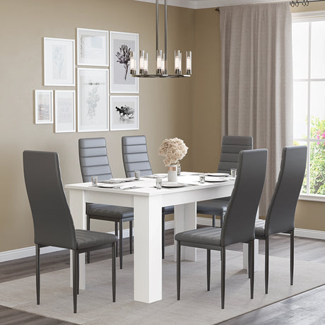 Grey dining chairs with white table set for 6 in a modern dining room. Ideal for stylish family dining spaces.