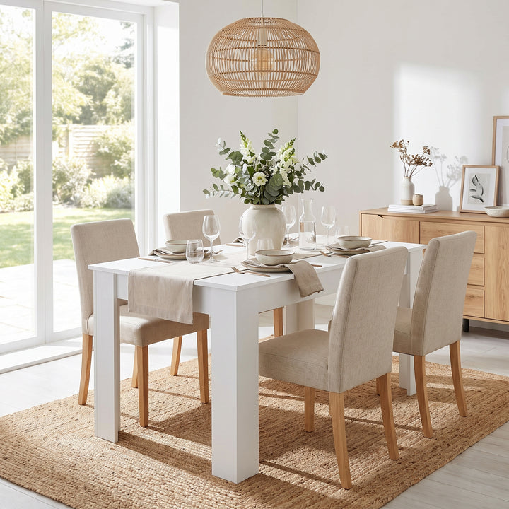 [120 cm | White] 4 and 6 Seater Dining Table Rectangle fully arranged with four beige fabric chairs and a center bouquet.