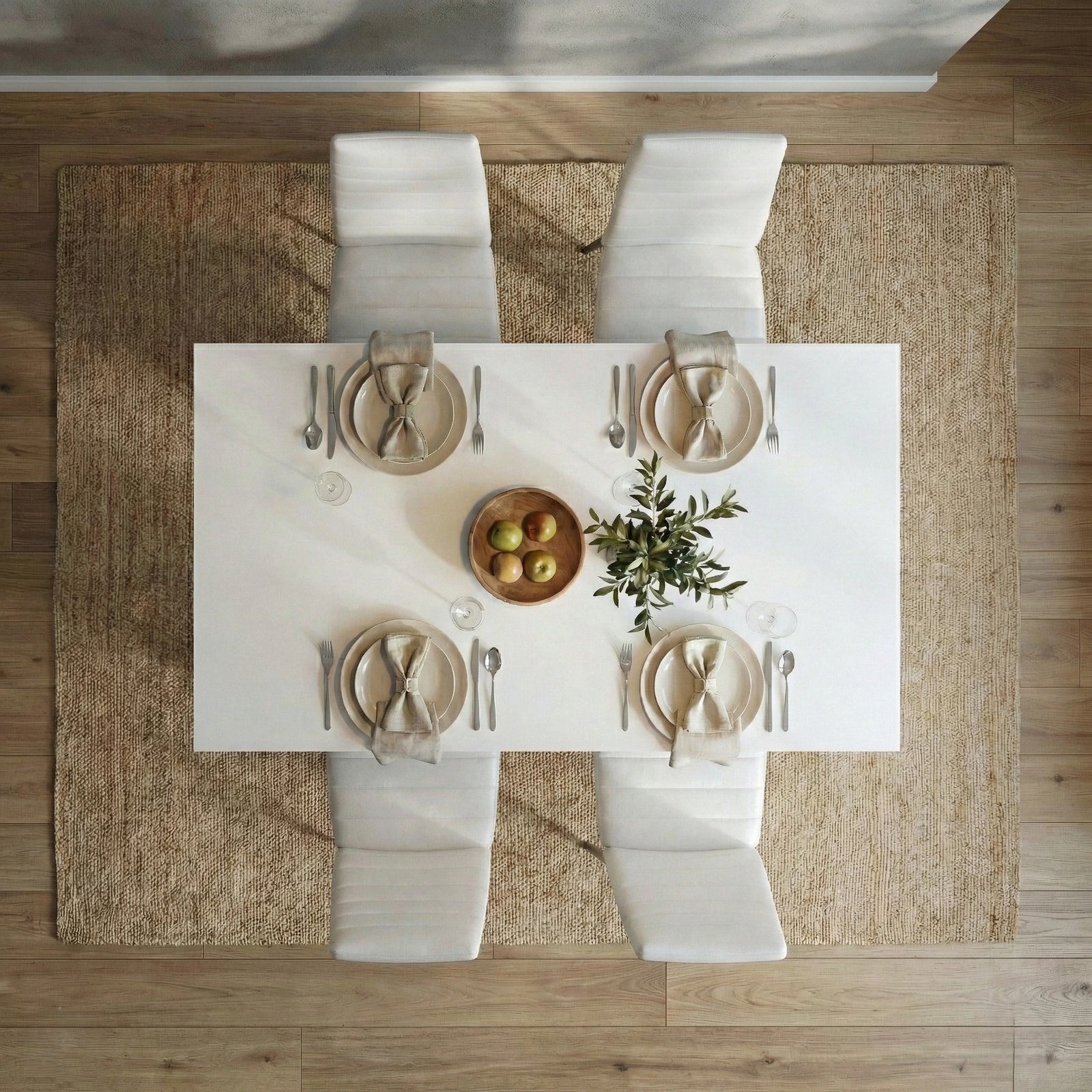 [4 Seater | White] White 4-6 Seater Dining Table and Chairs Set aerial overhead look at a minimalist four-person dinner arrangement with white plates, cloth napkins, and center