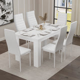 A white dining table and six chairs set in a neutral-toned room — a refined setting for modern family meals and gatherings.