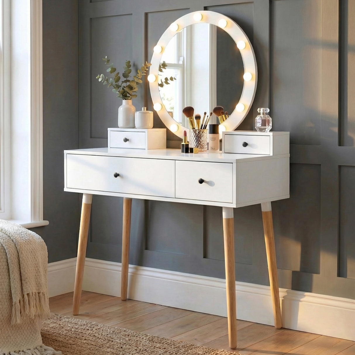 [White] Dressing table front view showing LED Hollywood mirror with makeup accessories and vase on tabletop