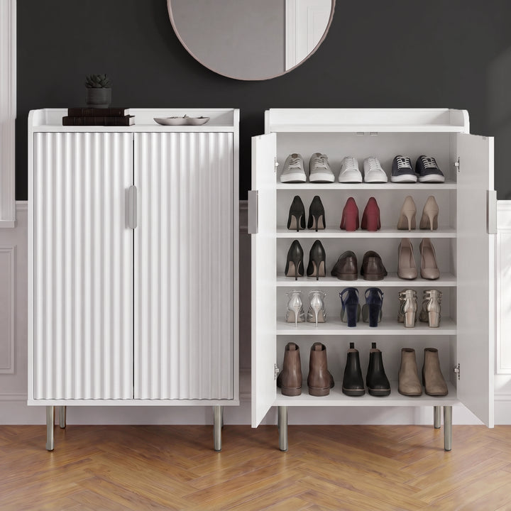 [White] Fluted White Painted 5 Tier Shoe Storage cabinet shown as a pair, one open displaying five shelf tiers loaded with varied footwear styles