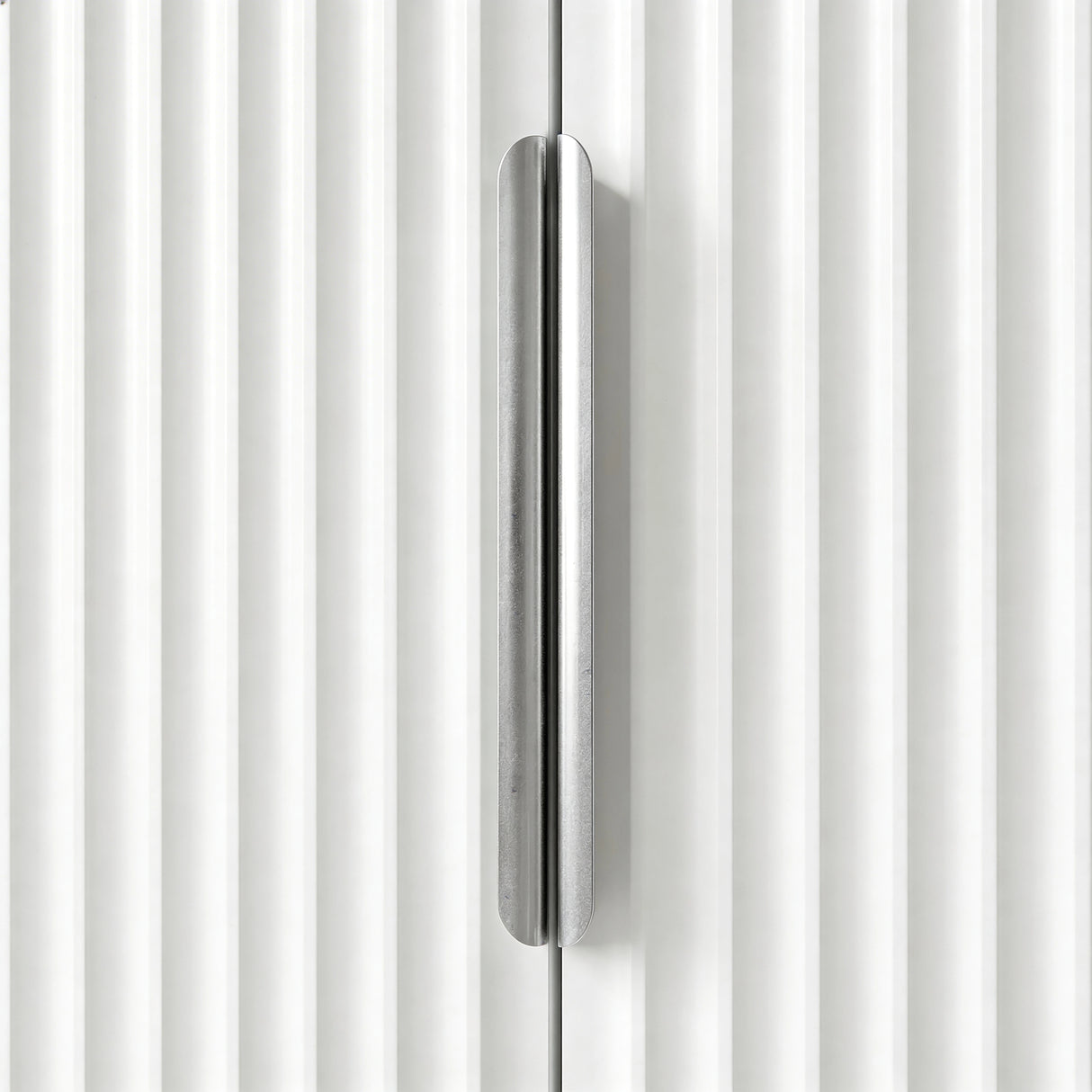 [White] Flutrina wardrobe door handle close-up detail in silver