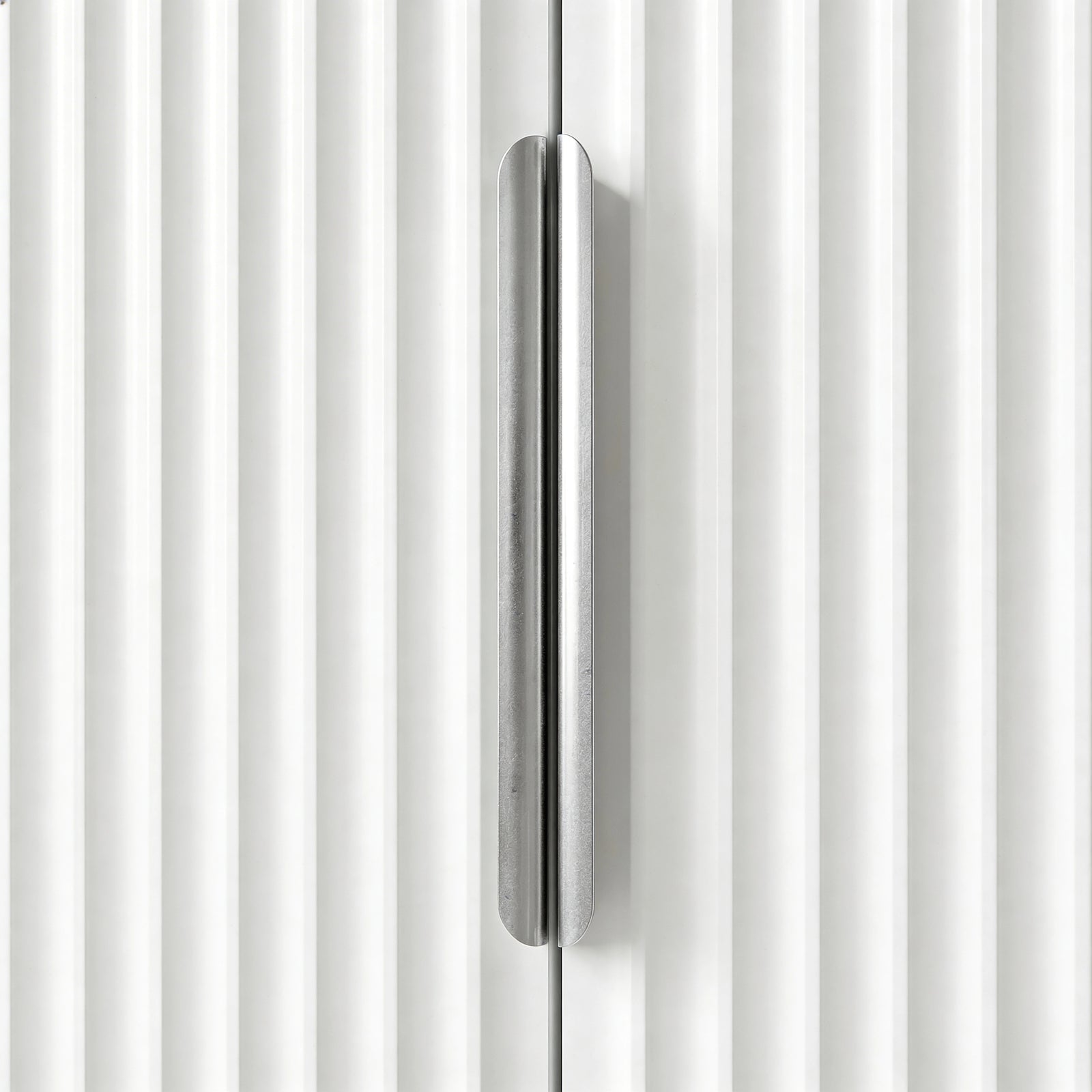 [White] Flutrina wardrobe door handle close-up detail in silver
