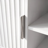 [White] Flutrina close-up showing fluted door grooves, brushed metal pull handle, and plain inner shelf edge.
