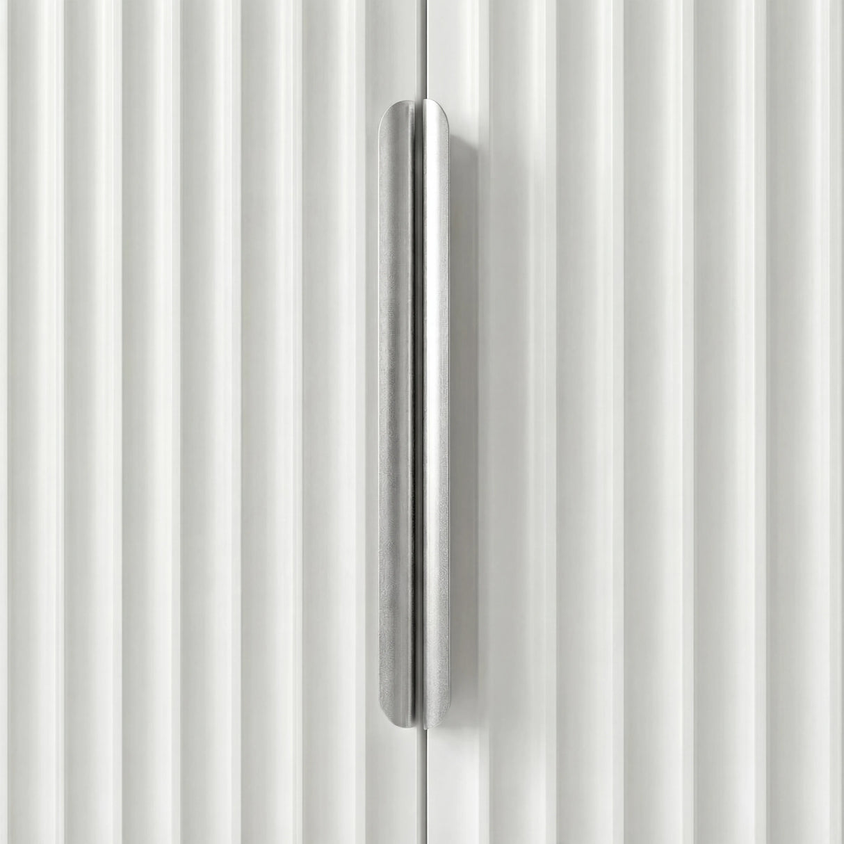 White flutrina wardrobe with two door vertical handle, close up of brushed silver metal finish