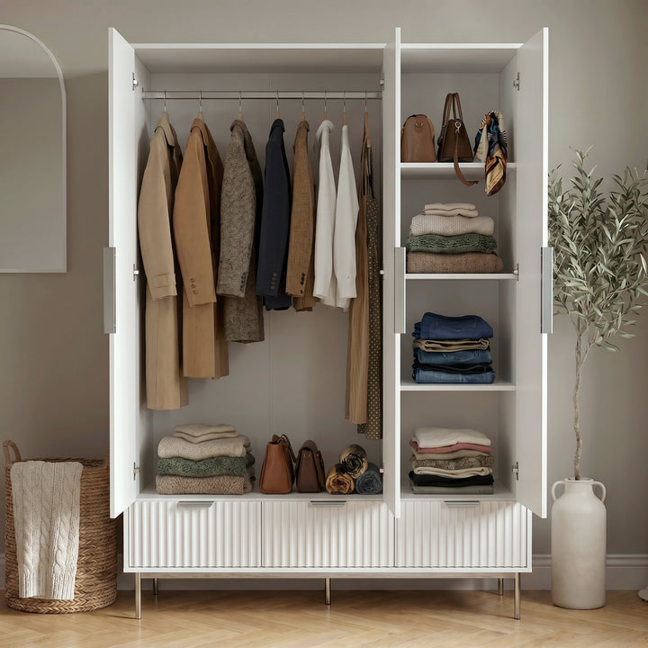 [White] Flutrina triple wardrobe interior with hanging rail for coats, four shelves holding folded knitwear and bags
