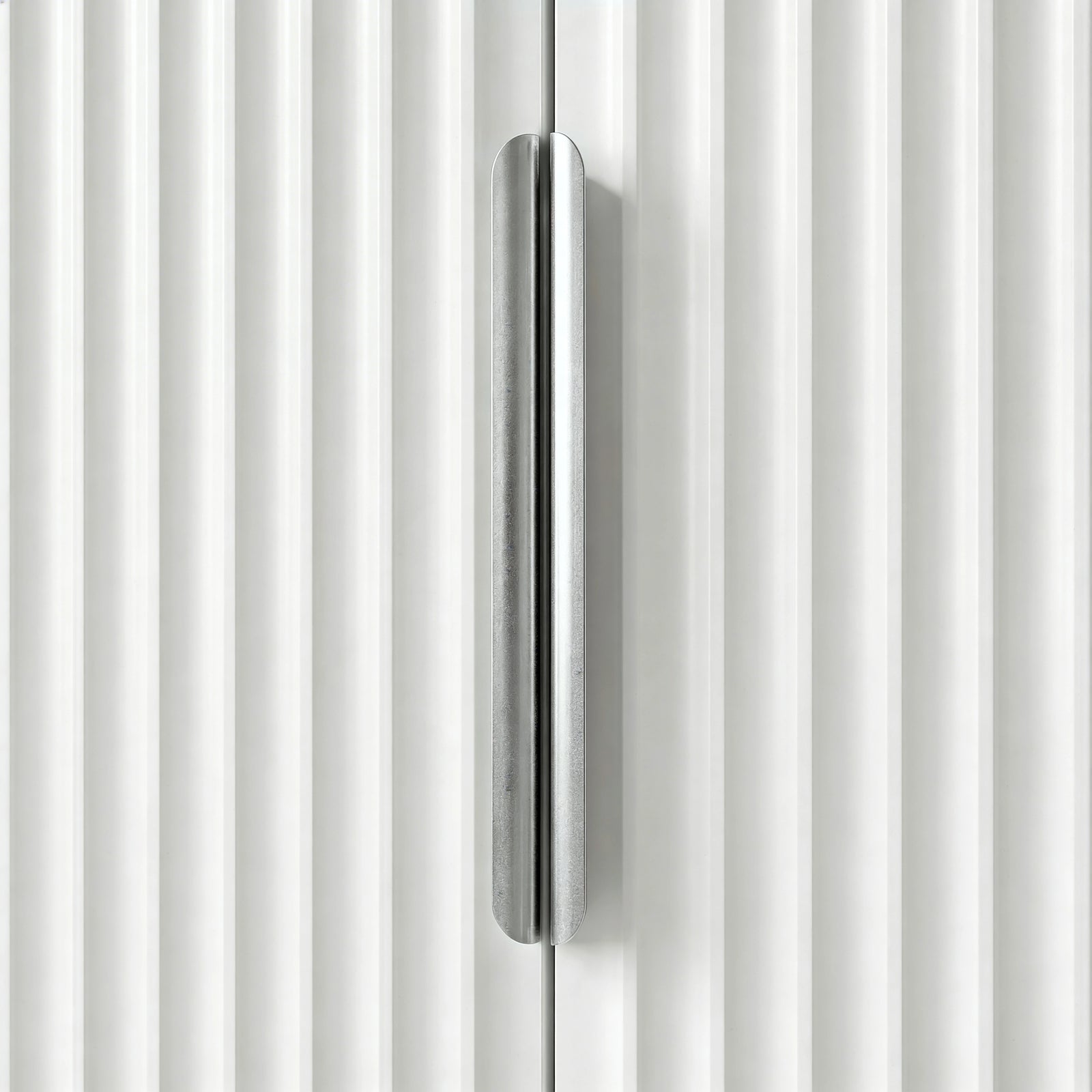 [White] Flutrina wardrobe close-up of brushed silver bar handle set against vertical ribbed fluted panelling