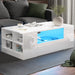 White coffee table with blue LED lighting in a living room setting
