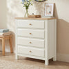[White] Haven 4 drawer chest with oak top and round oak knobs shown at a three-quarter angle in a warm neutral bedroom