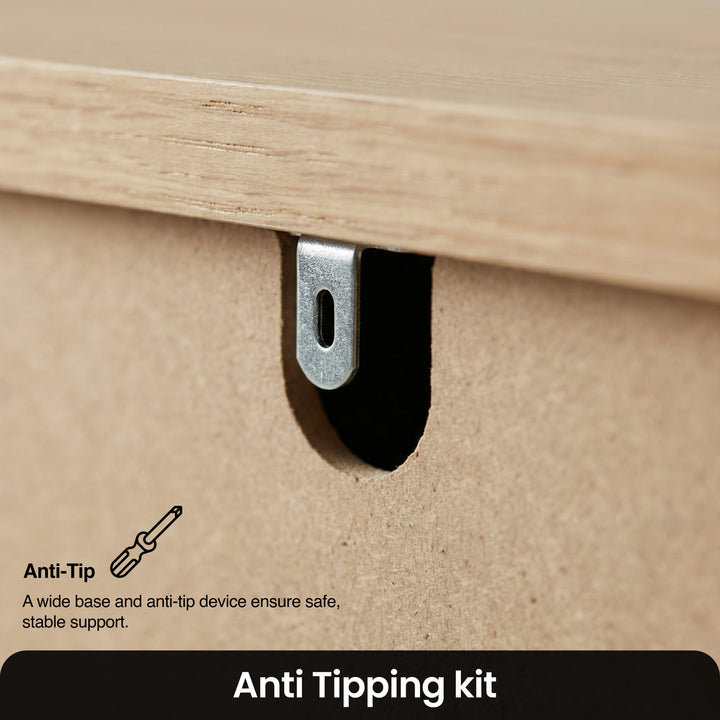 [White] Haven chest detail showing the steel anti-tip bracket hardware mounted beneath the solid oak top edge