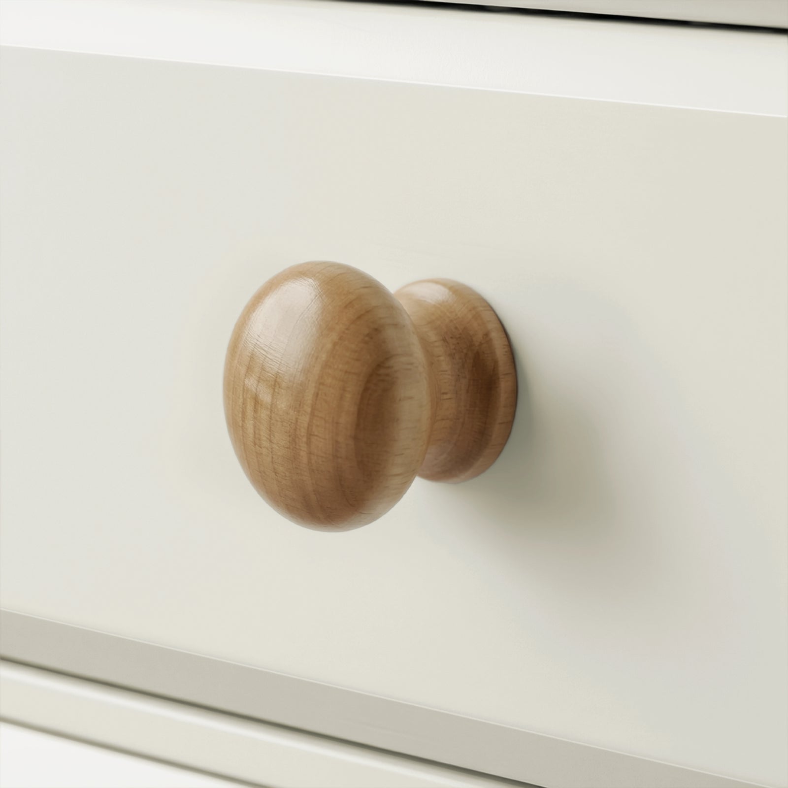 [White] Haven chest detail showing a rounded solid oak drawer knob against the clean white painted drawer front