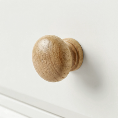 [White] Haven chest detail showing a rounded solid oak drawer knob against the clean white painted drawer front