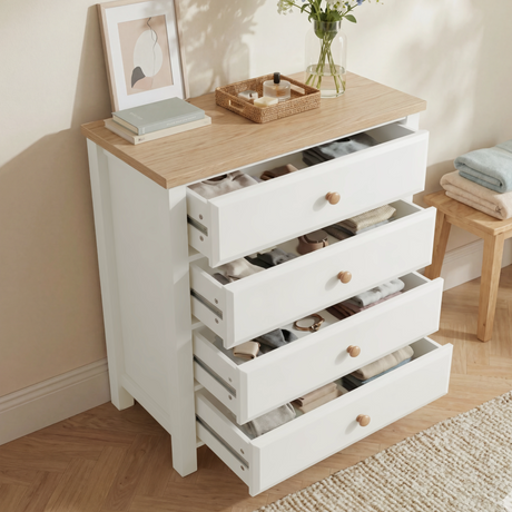 [White] Haven 4 drawer chest with all four drawers extended open, showing neatly organised accessories and clothing
