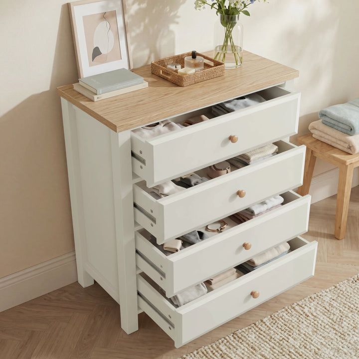 [White] Haven 4 drawer chest with all four drawers extended open, showing neatly organised accessories and clothing